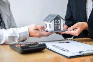 A person discussing mortgage issues and foreclosure mediation with a bankruptcy lawyer